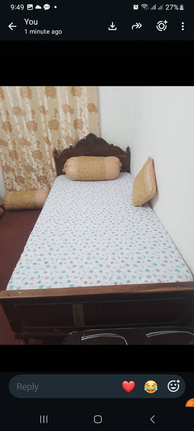 Wooden bed with mattress is for sale