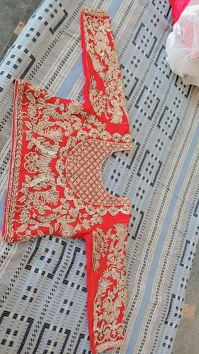 i am selling a gorgeous bright red bridal lehanga worn only once .