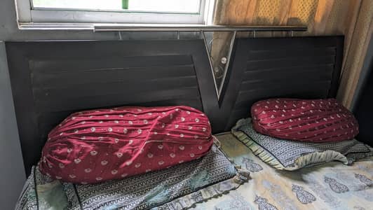 double bed with mattress and side table