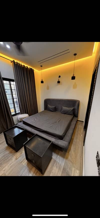 Solid bed with side tables up for grab