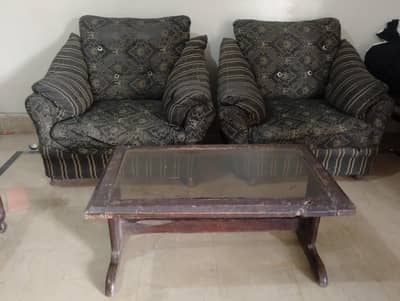 single seater  2 sofas with wooden. table read