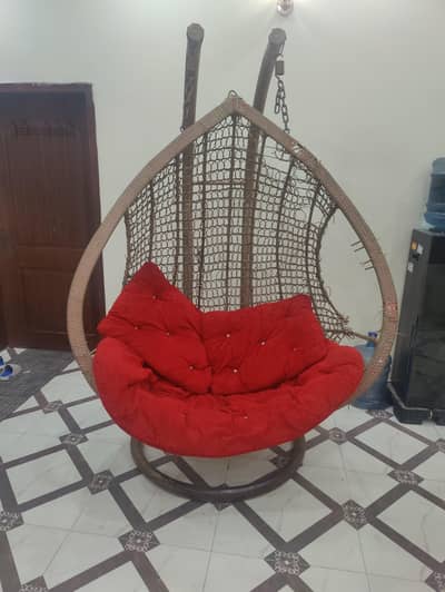 Double seater swing with cushions