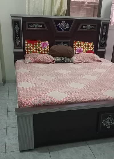 brown wooden bed