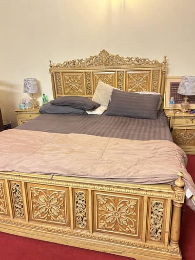 King sized bed with 2 side tables, dressing table and a sofa
