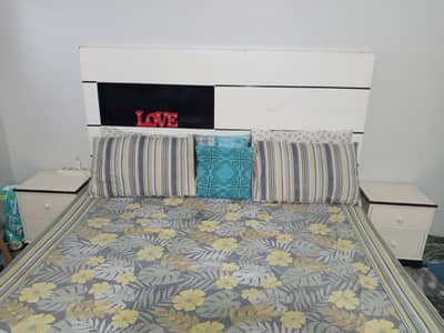 King size bed with side tables and dressing table