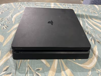 PS4 Slim 1 TB 10/10 condition