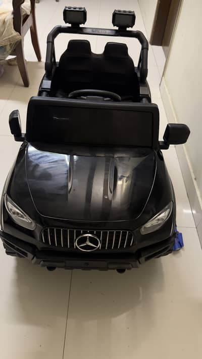 black Mercedes-style battery-operated ride-on electric jeep for kids,