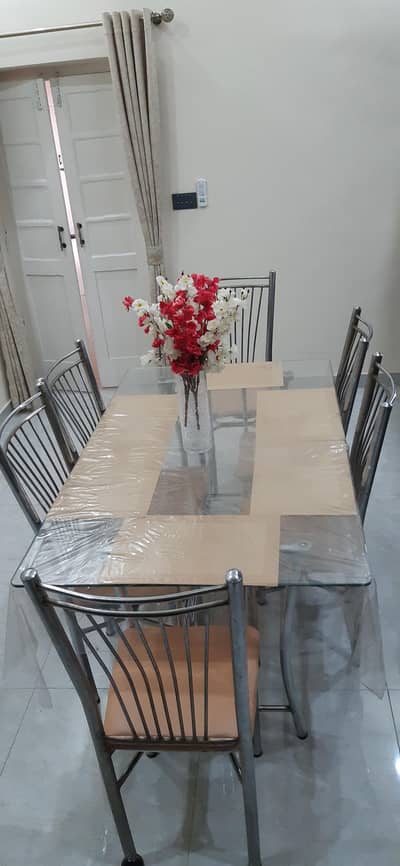 chrome finished steel dining table with 6 dining chairs