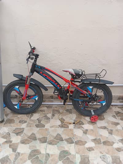 red,blue and black bicycle with three removeble wheels.