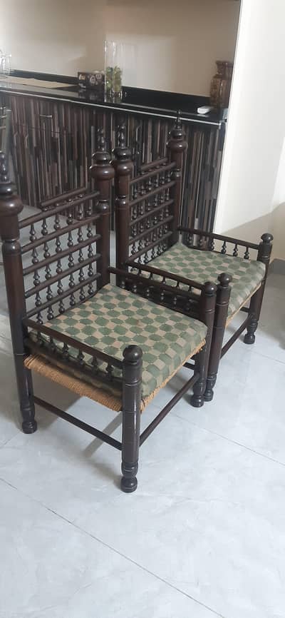 2× wooden arm chairs with cushions