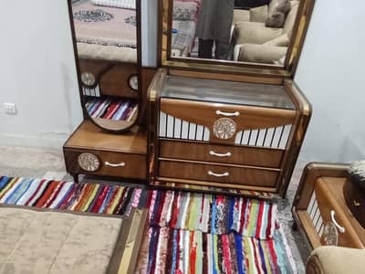 bed with satte two side tables and drssing table mirrors