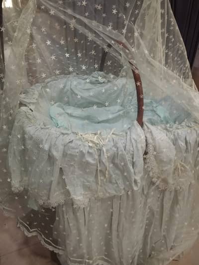 Cane cot with sheets and netting. NO DELIVERY.