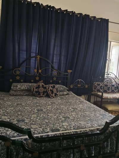 iron king size bed with side tables