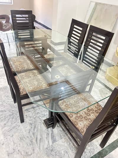 six seater wooden dining table with glass top for sale Rawalpindi. .