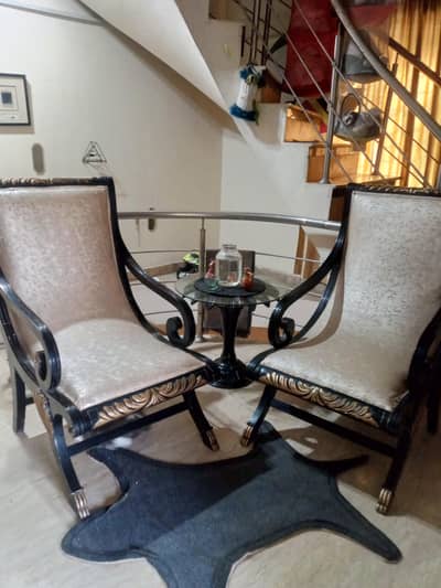 2 chairs with table