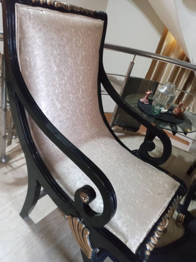 Scroll arm ancient chairs with round table 1