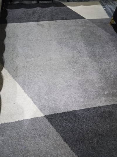 a grey and black carpet in great condition