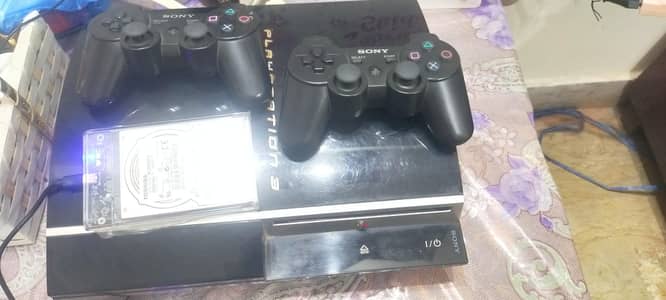 Ps3 Jailbreak with 2 wireless Controllers in good condition.