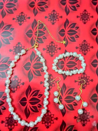 white pearl set with earing and braclet customization is availble
