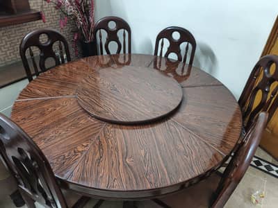 pure solid wooden dinning table along with 6 chairs