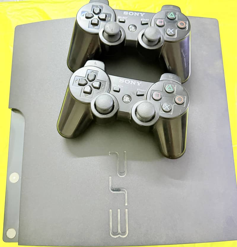 PS3 console with controllers 0