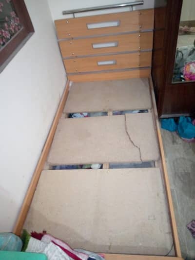 single wooden bed without ma