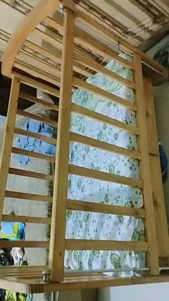 wooden baby cot new born to 4 year , almost new , 2 drawers , 4 wheels