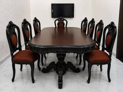 Beautiful vintage-style dining table with 8 matching chairs for sale.