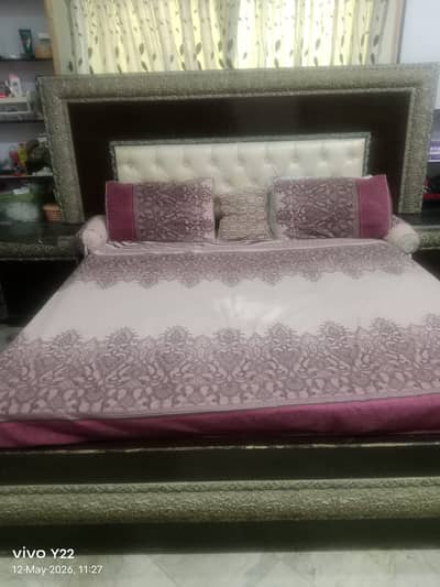 Double bed, side tables and dressing table.