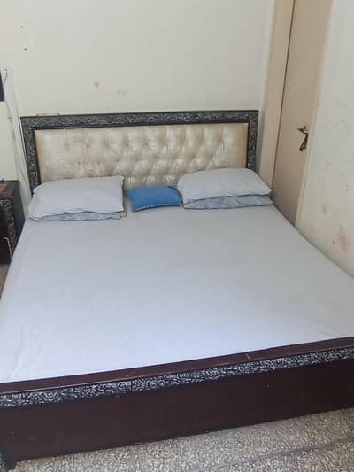 king size bed with single side table and mattress