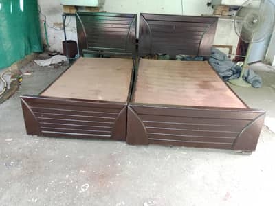 2 wooden single bed