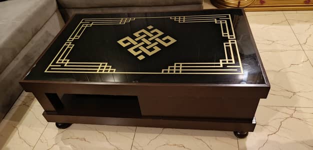 Wooden Rectangular Coffee table with glass top.