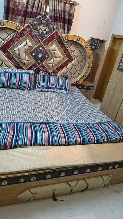 bed with side table or dressing table with almari