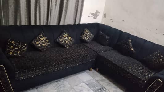 10 by 9 condition L shaped sofa with seven cution black colour