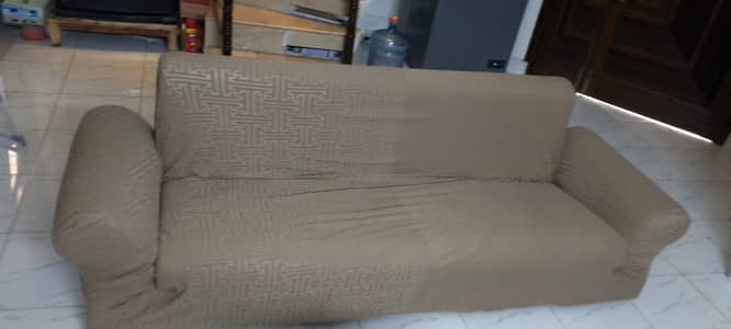 Sofa combed with cover in the image