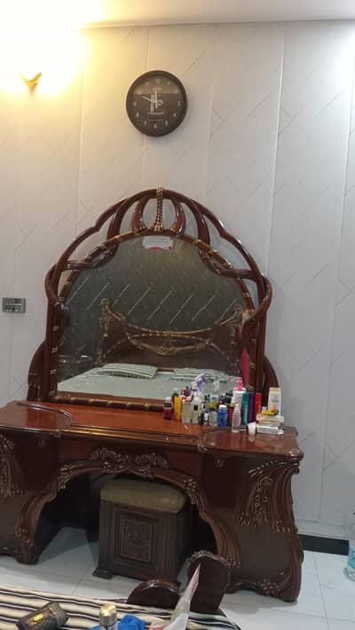 bed with two side table and dressing table