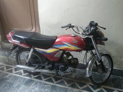 red Honda dream CD 70 bike Lahore