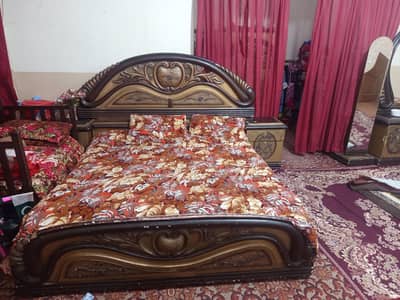 bed and two set tables