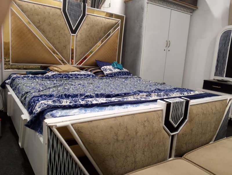 white colour used bed set dressing table side table. 1