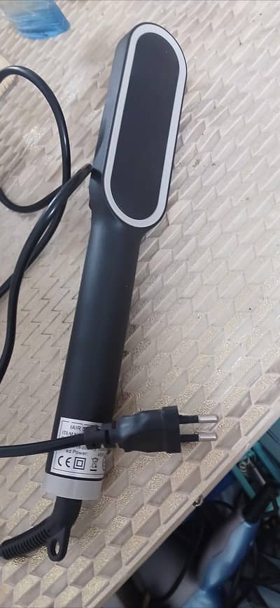 Hair straightener plus comb