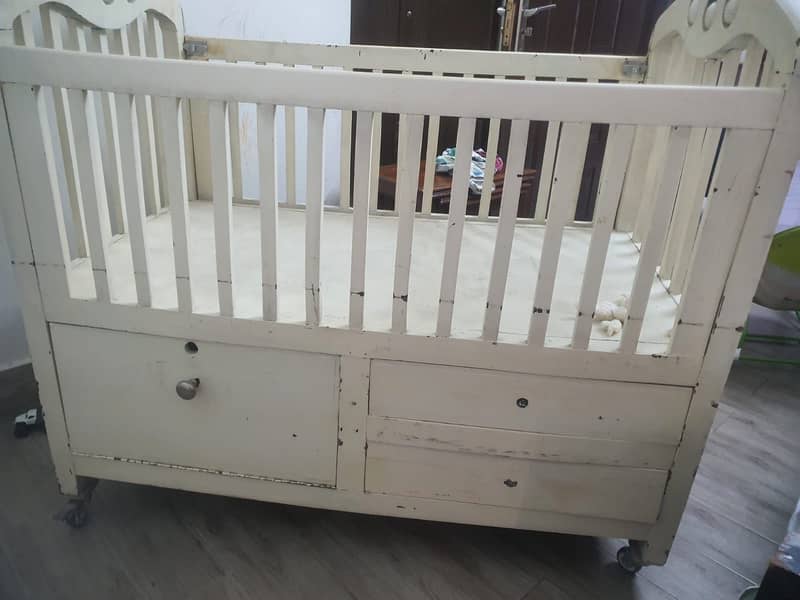 Solid wood crib with storage and lockable wheels 1