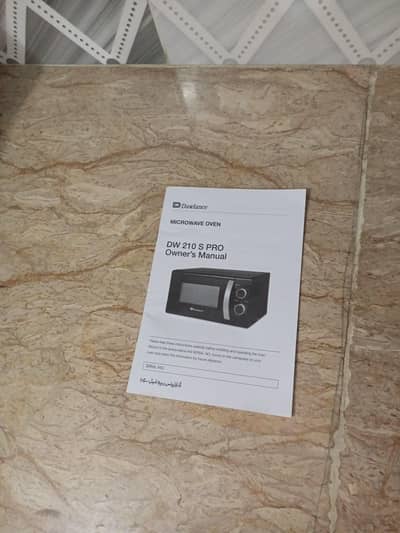 Brand new microwave oven with 7 years warranty card