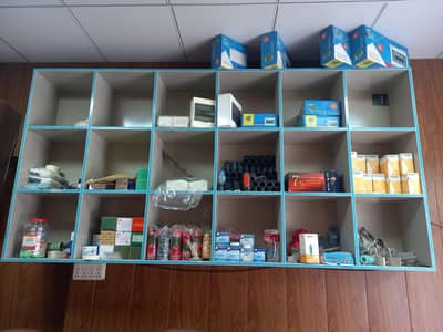 shop rack & shelves and cabinets , table , ceiling,  front seeaha fram