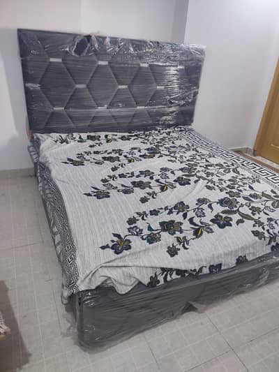 Full size cushioned bed set with 2 side tables.