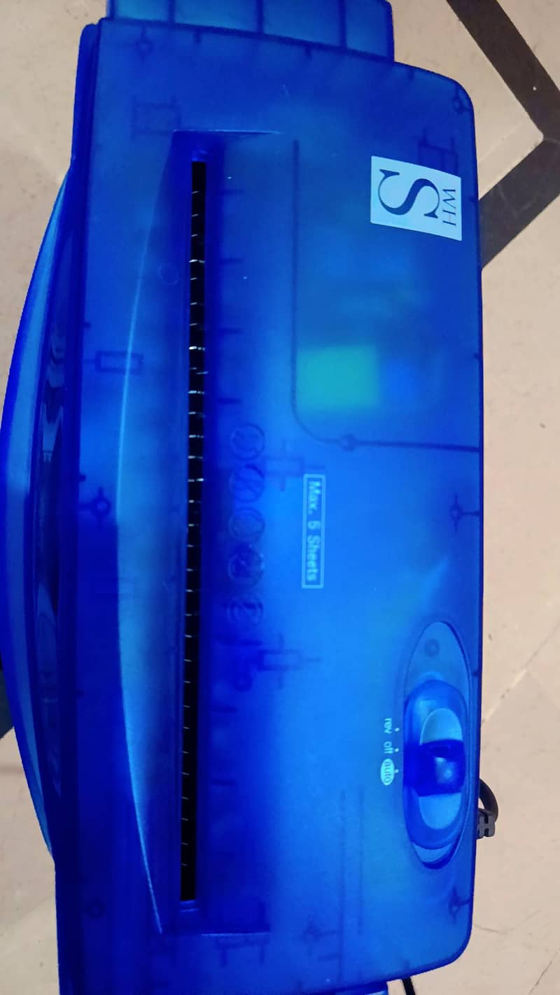 Blue translucent paper shredder "Max. 5 Sheets featuring reverse,auto 3