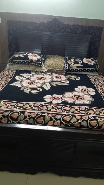 Queen size bed along with dressing table