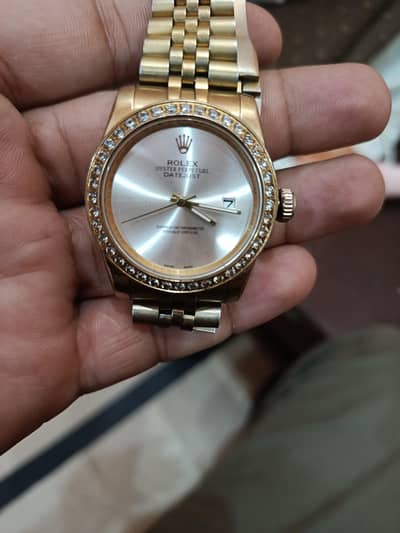 Gold tone Rolex watch