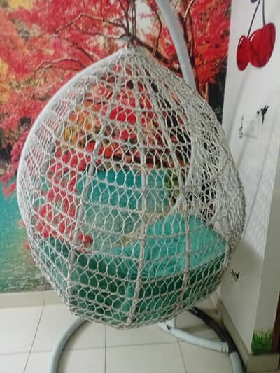 white swing with iron frame
