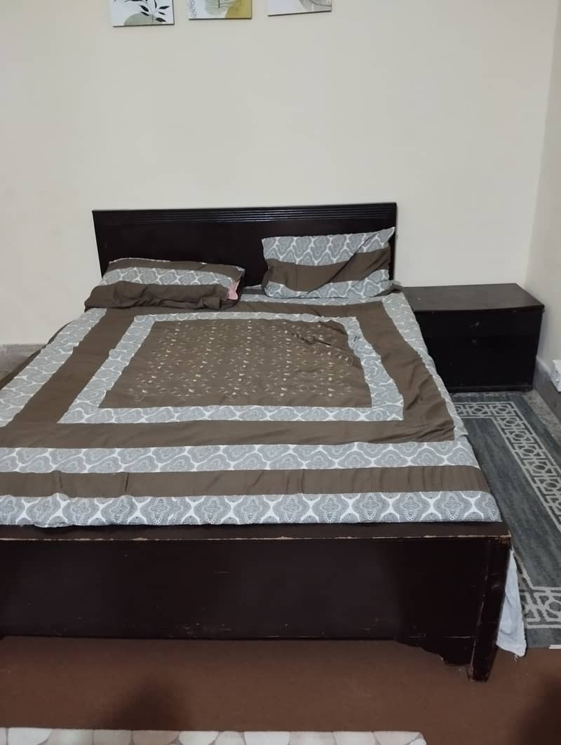 Queen size bed with side table  0