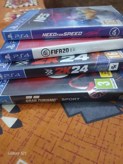 4 cd's of ps4 NFS(HEAT)   FIFA20  WWE24  GRAND TURISMO